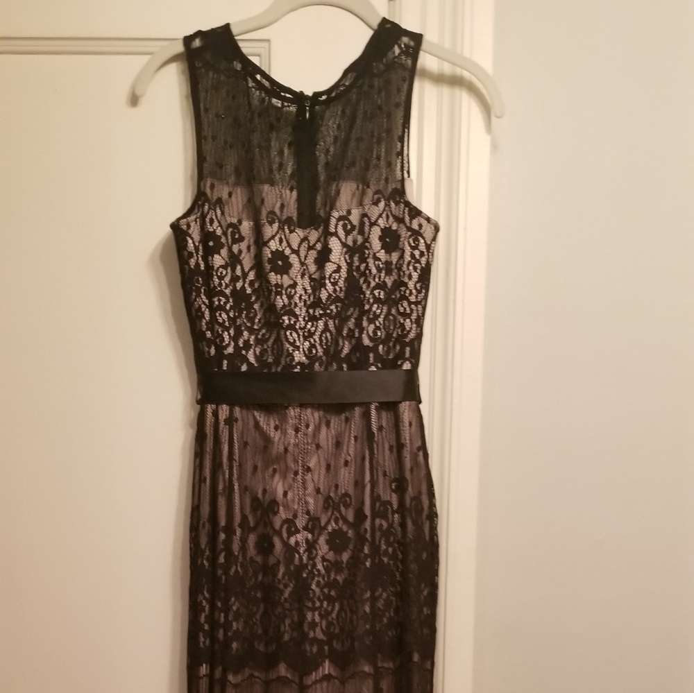 Black tie gown worn once.  Small train in the back